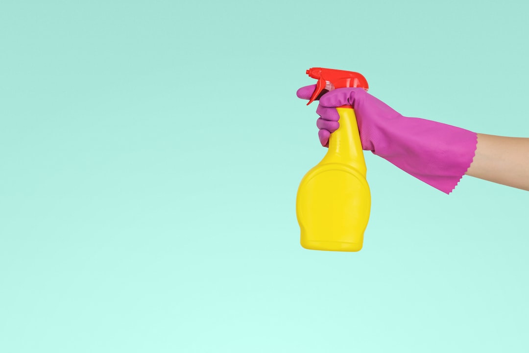 services-img person-holding-yellow-plastic-spray-bottle-zmnefoi3k